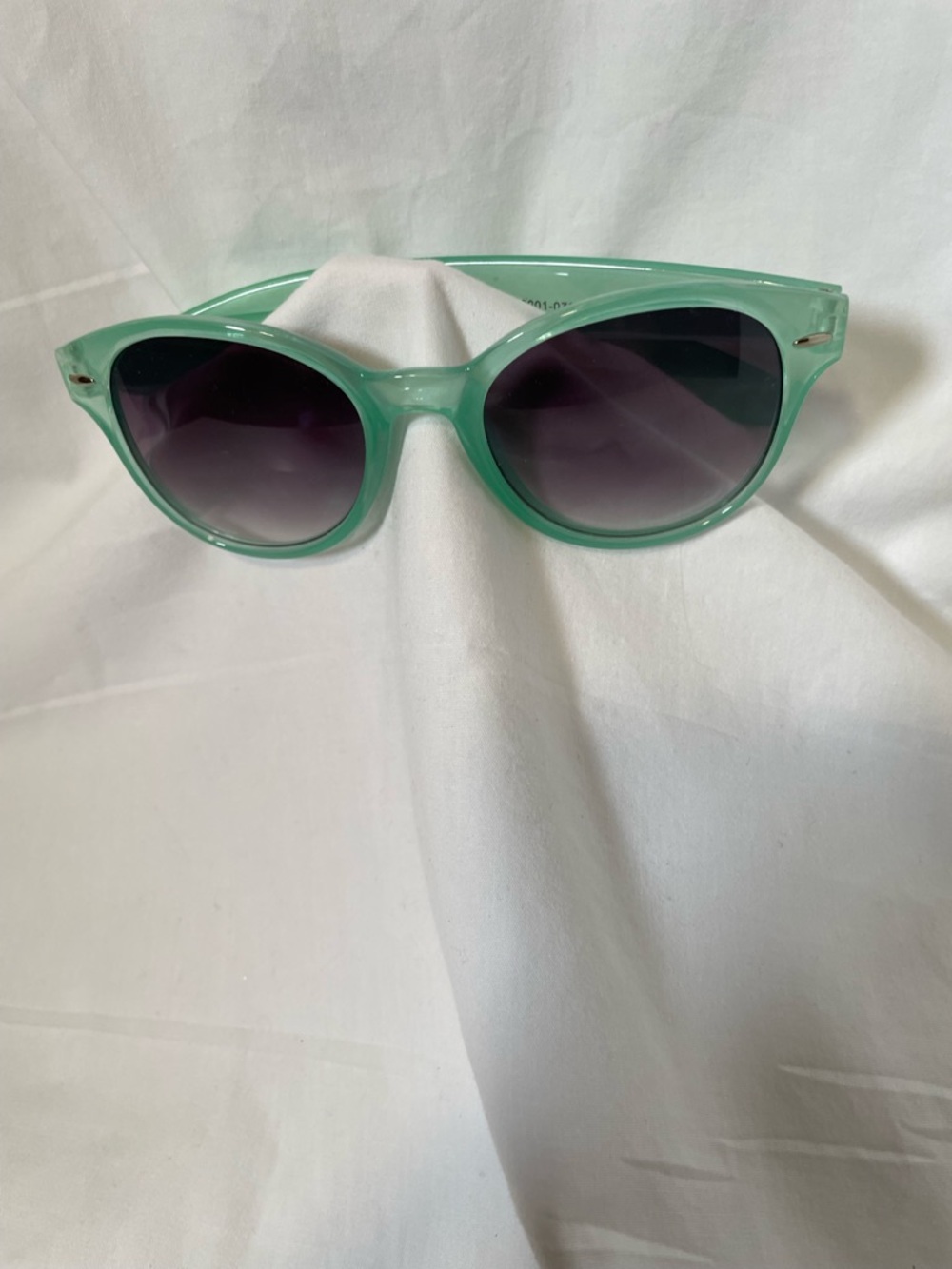 Light blue frame sunglasses